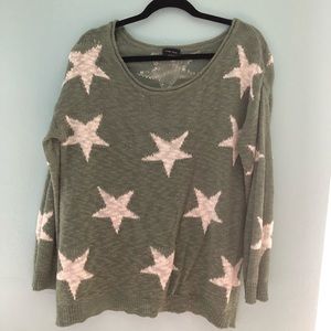 Green sweater with white stars